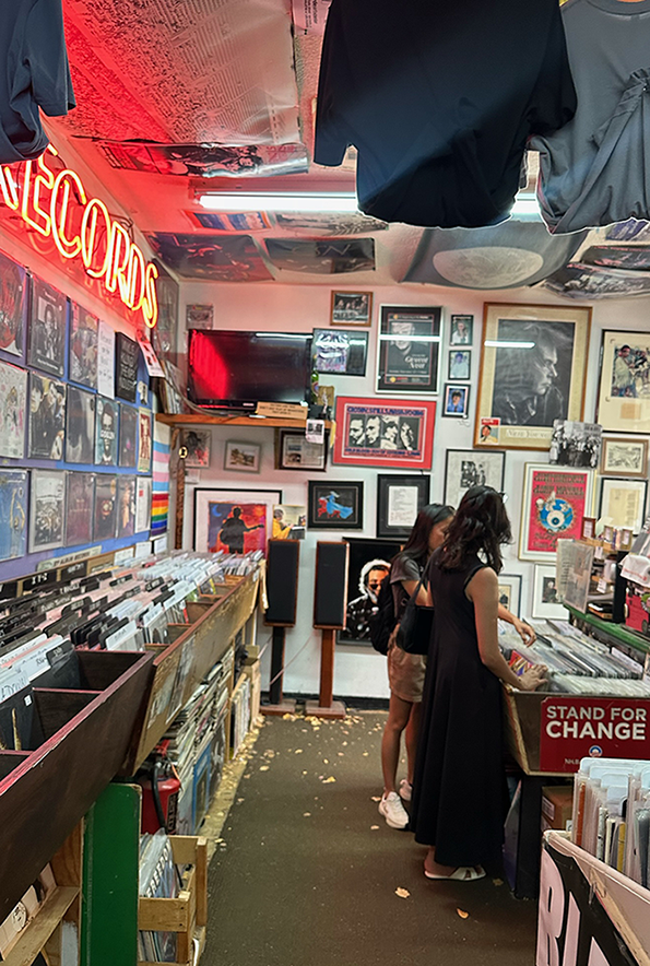 Two girls shopping for records at Mystic Disc